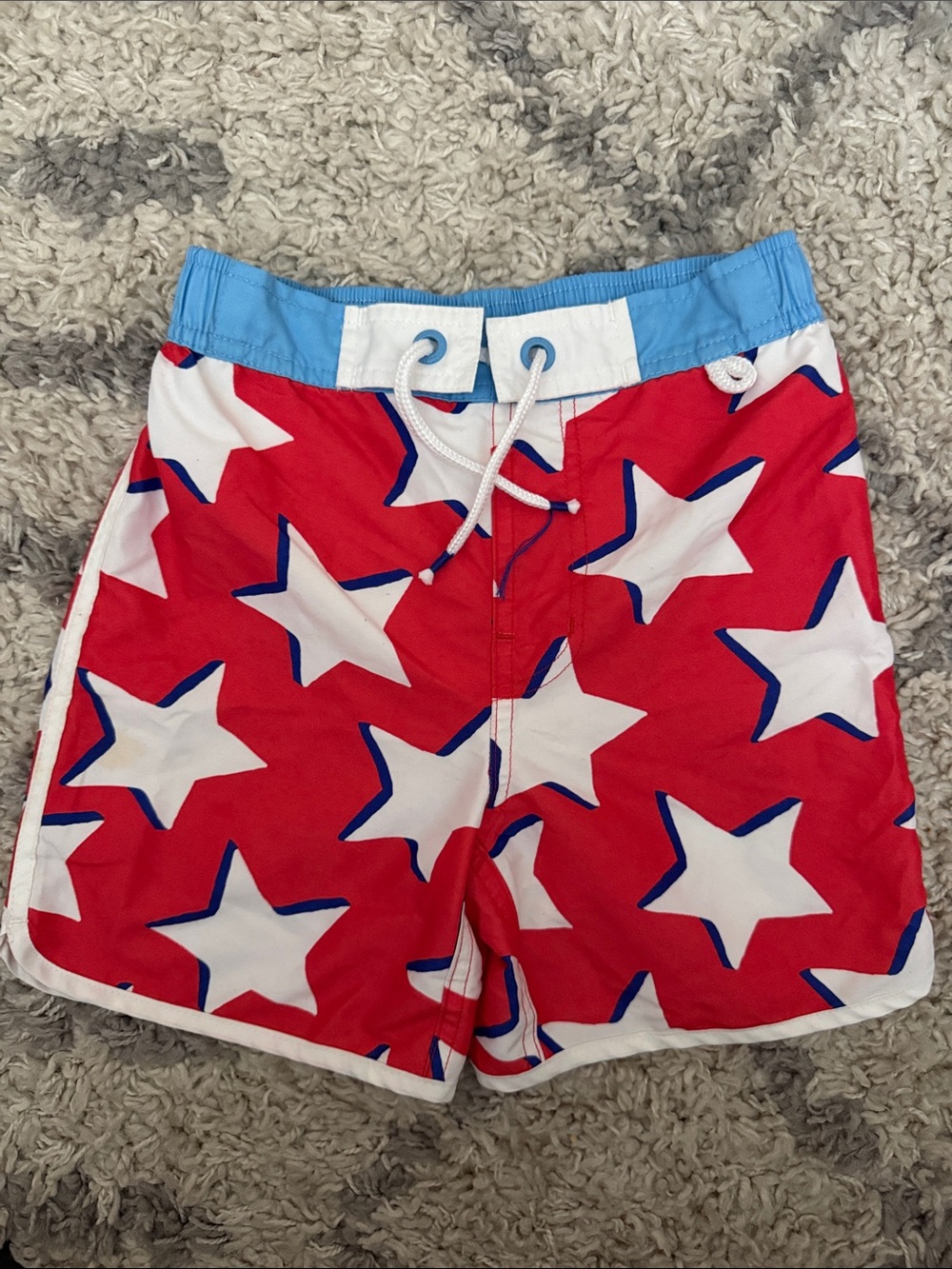 Mini Boden Red Star Print Swim Shorts with Light Blue Waistband